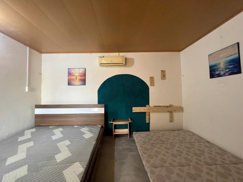 Ένα ή περισσότερα κρεβάτια σε δωμάτιο στο Hiên Nắng Beach