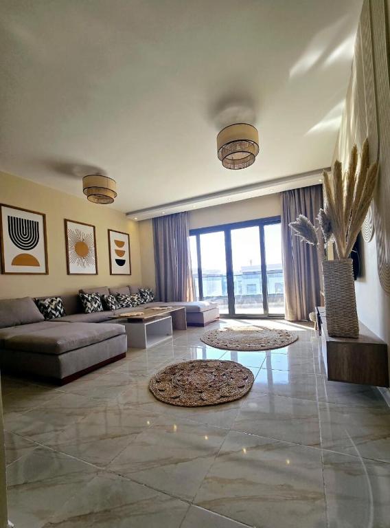 a living room with a couch and a table at B15/87/51 · Madinaty B15 Brand new 3BR Apt in Madinaty