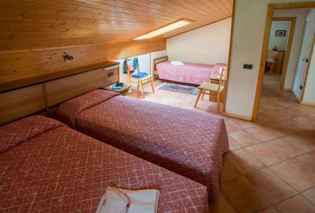 Postel nebo postele na pokoji v ubytování Residence Betulla Molveno