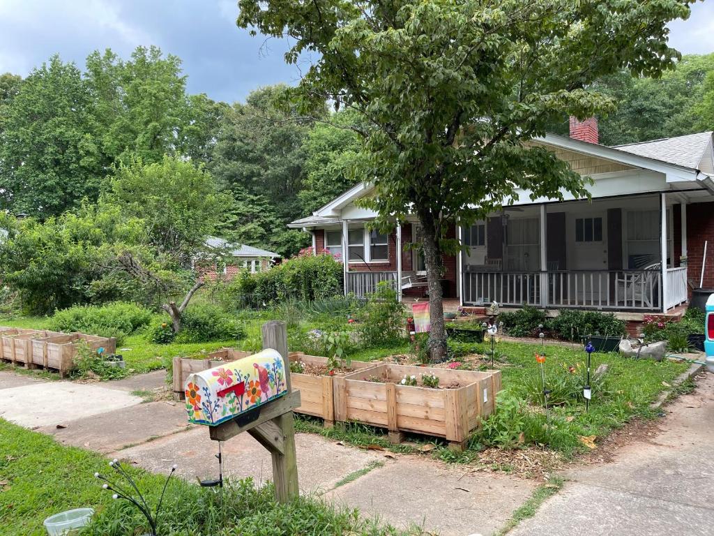 a garden with a mailbox in front of a house at Dog Friendly 1 bd 1 ba near Airport and Marta in Atlanta