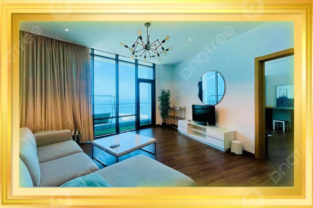 Μια τηλεόραση ή/και κέντρο ψυχαγωγίας στο Cozy Apartment in Seef