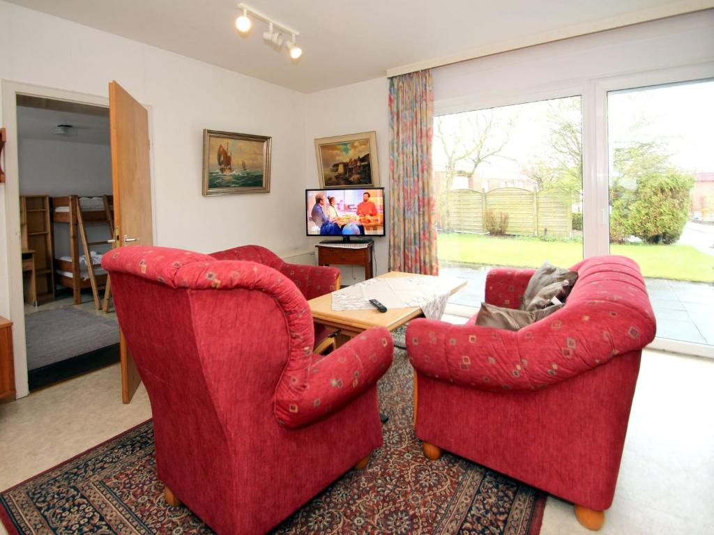 TV a/nebo společenská místnost v ubytování Bungalow, Dornumersiel