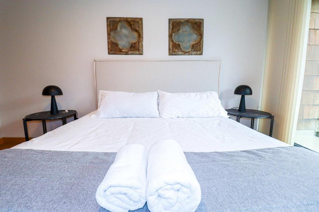 En eller flere senge i et værelse på HOM I Edif frente a la Costanera 1D1B 4 PAX