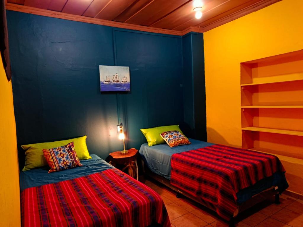 Postel nebo postele na pokoji v ubytování Expresión cultural restaurante y alojamiento