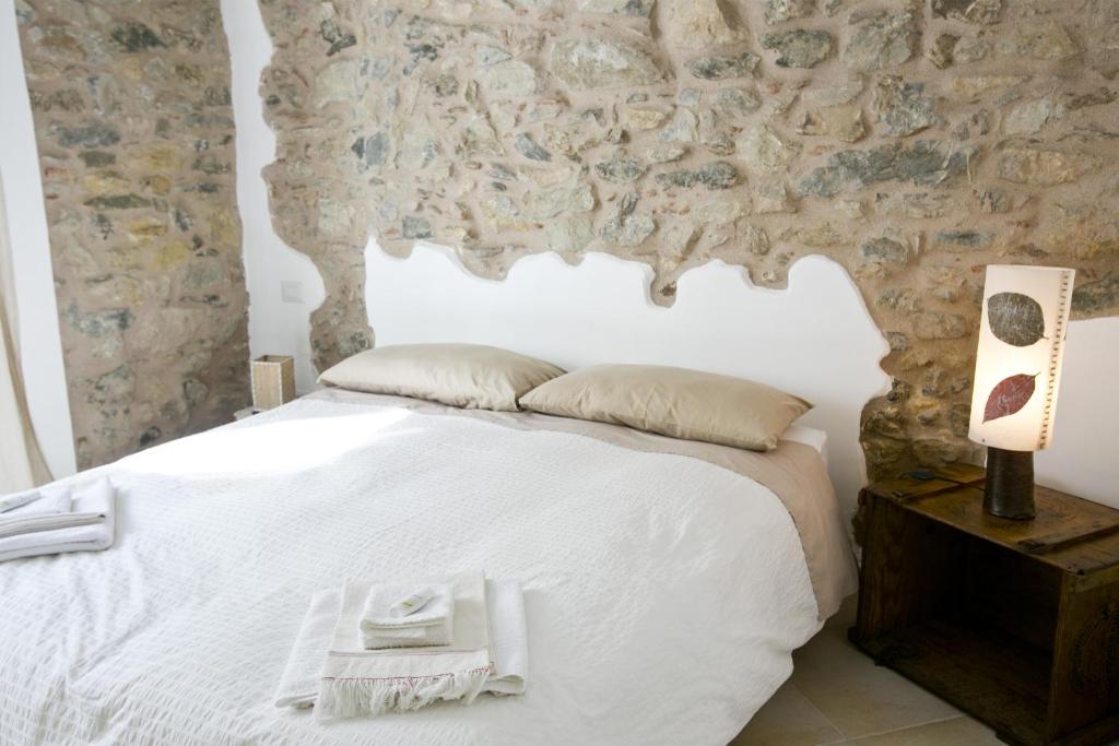 Кровать или кровати в номере La Via del Carretto B&B