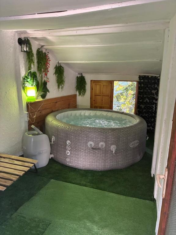 a bathroom with a large tub in a room at Casa rural privada in Orihuela