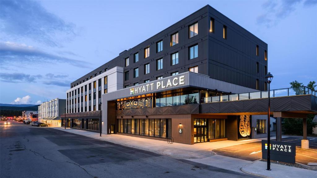 a black building with a sign that reads start dance at Hyatt Place Whitehorse in Whitehorse