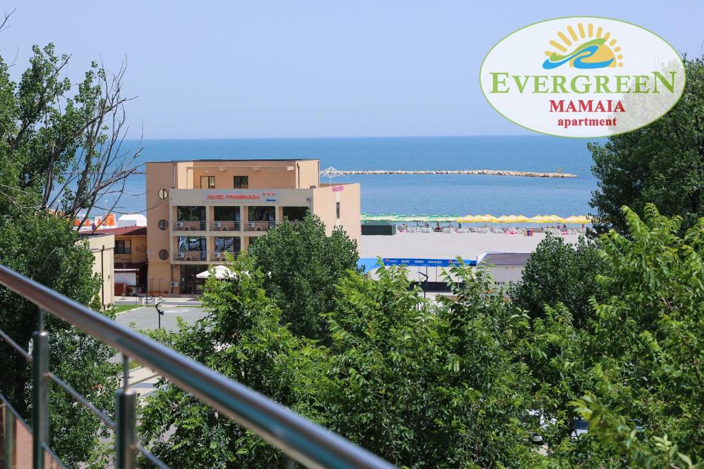 a sign for a hotel with a view of the ocean at Evergreen Vlas Mamaia Sud in Mamaia