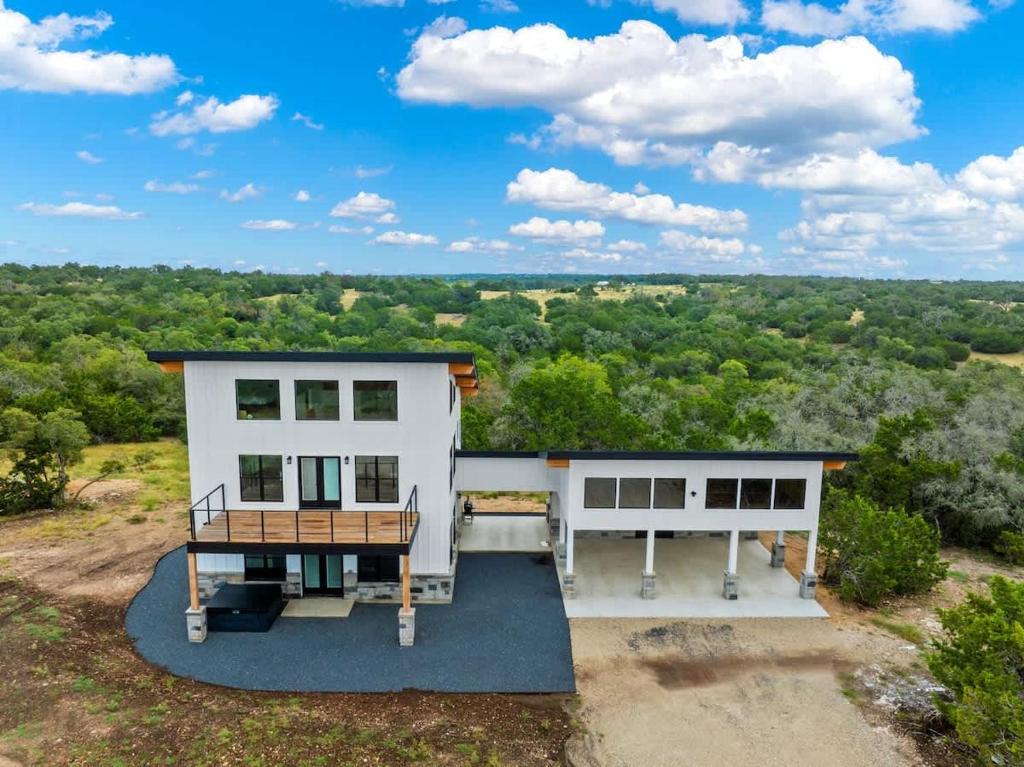 an aerial view of a house at Hill Country Escape w/Views Plus, Hot-Tub and Pet Friendly! in Tivydale