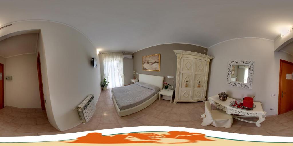 Postel nebo postele na pokoji v ubytování Hotel Velcamare