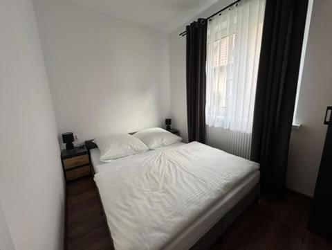Giường trong phòng chung tại Willa Gazda Apartamenty