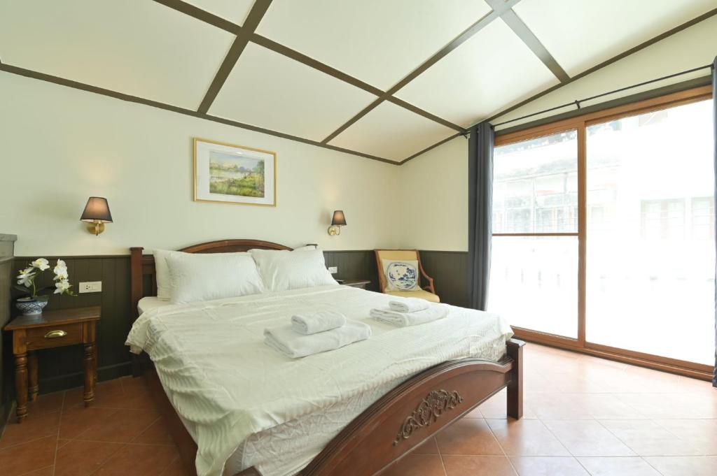 Giường trong phòng chung tại Villa Mungkala