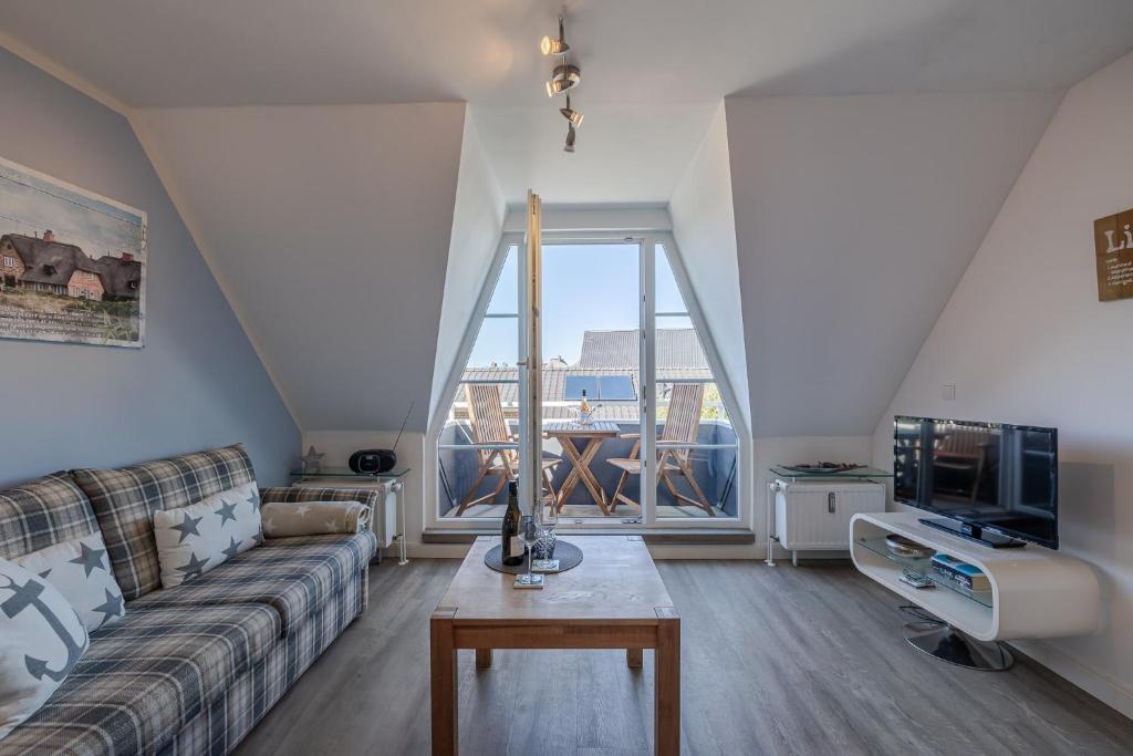 Televiisor ja/või meelelahutuskeskus majutusasutuses Dünenrand