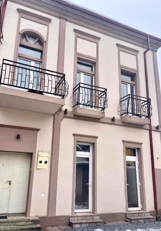 a building with balconies on the side of it at VP Apartments Bitola in Bitola