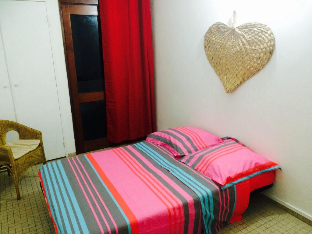 Postel nebo postele na pokoji v ubytování Maison Petit Paradis