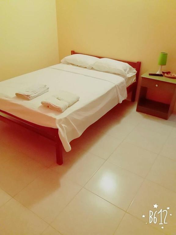 Postel nebo postele na pokoji v ubytování Hostal Montecarlos