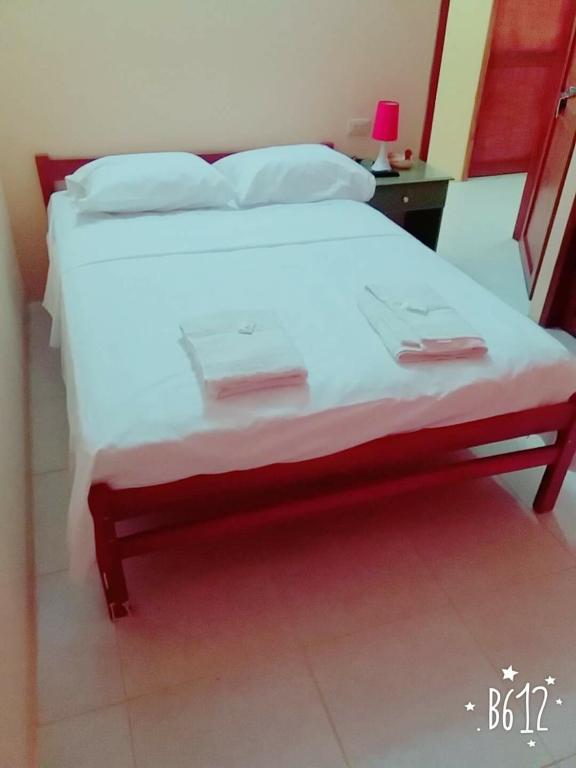 Postel nebo postele na pokoji v ubytování Hostal Montecarlos