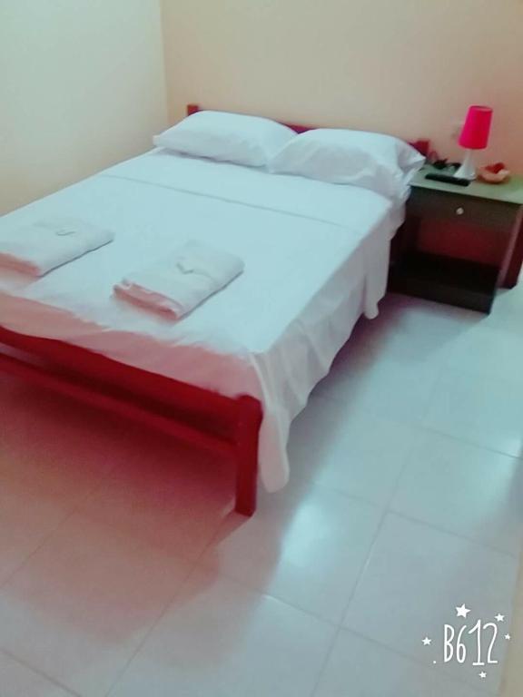 Postel nebo postele na pokoji v ubytování Hostal Montecarlos