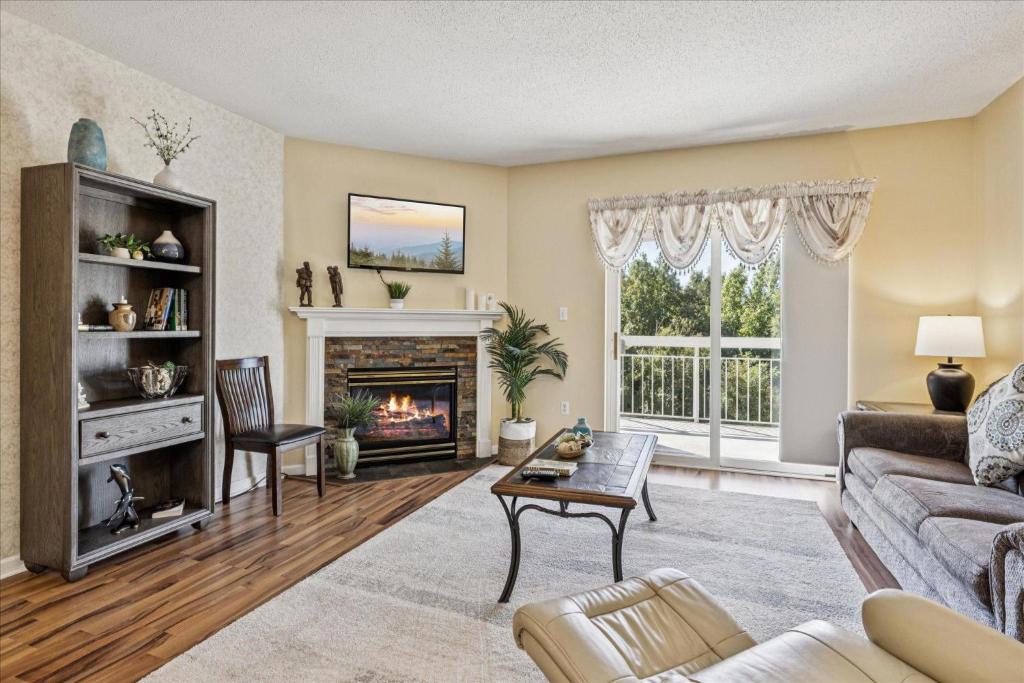 a living room with a couch and a fireplace at WP431 Private Sunsets in Pigeon Forge