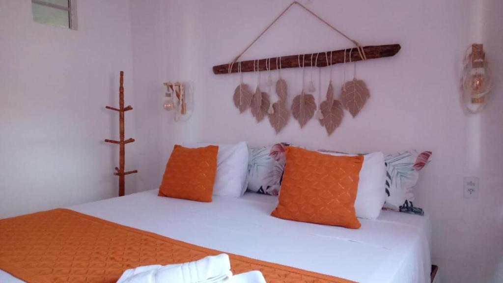 En eller flere senge i et værelse på Lounge Vila Tatajuba