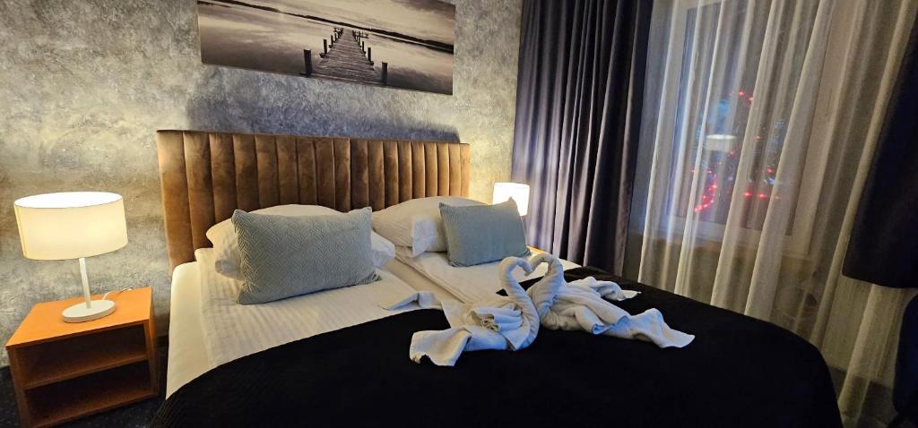 Postel nebo postele na pokoji v ubytování Apartament WODNY RAJ