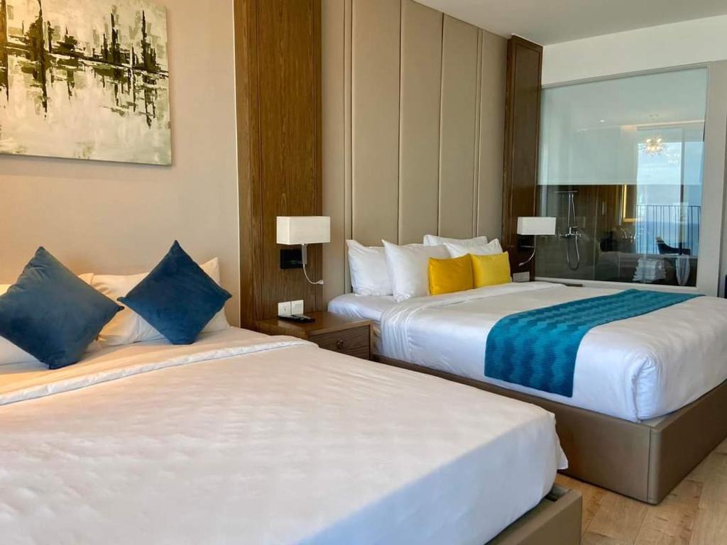 Giường trong phòng chung tại Tropical Ocean Escape Nha Trang