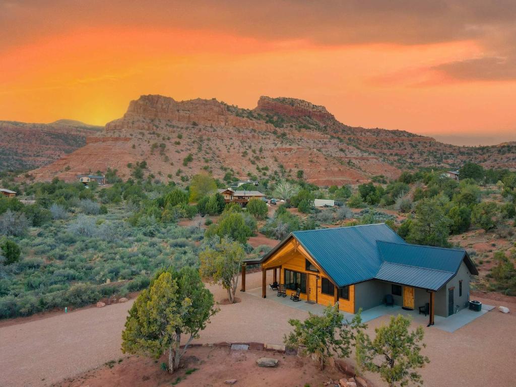 an overhead view of a house with a blue roof at Casa Vermillion Modern Kanab Family Cabin Red Rock Views Near Zion in Kanab