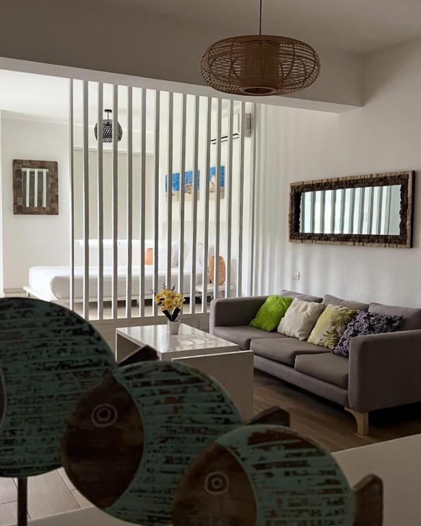 a living room with a couch and a table at punta cana residencial bavaro beach in La Cruz de Mendoza