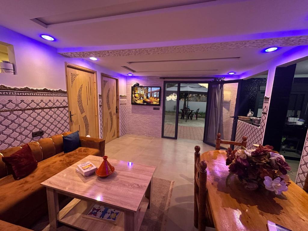 a living room with a couch and a table at Casa Del Mar Briech in Asilah