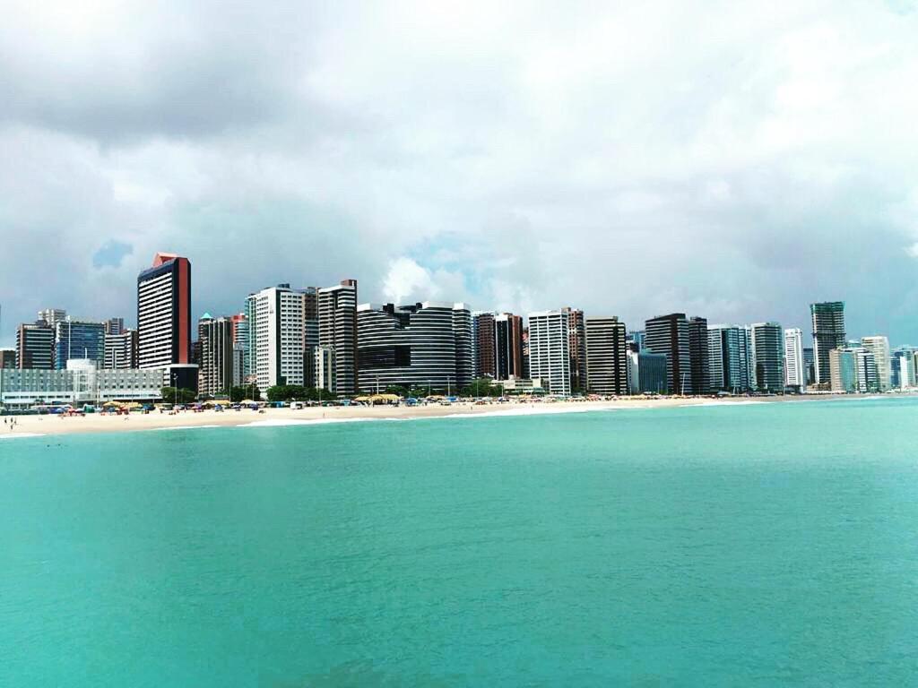 a view of a city from a beach with the ocean at Alta Vista Apartamento - 1min da Praia de Iracema in Fortaleza