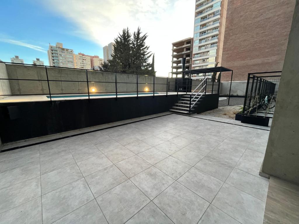 a rooftop patio with stairs on a building at Premium Studio in Downtown in Neuquén