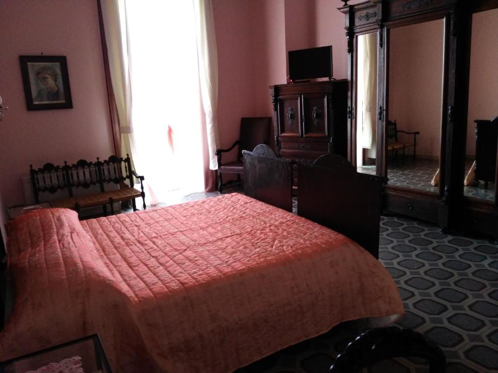 Postel nebo postele na pokoji v ubytování Domus Cicerone
