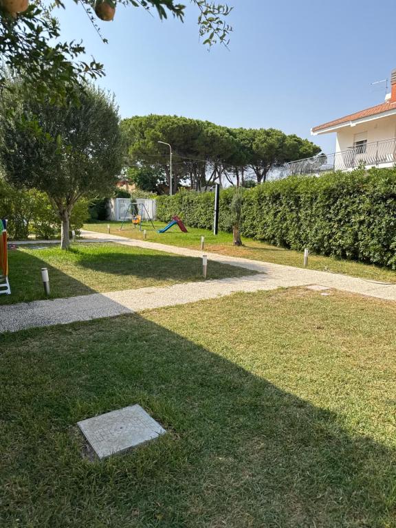 a park with a pathway and a playground at Maruta Siracusa in Arenella