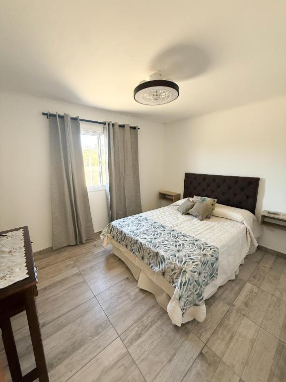 a bedroom with a large bed in a room at Las Magnolias CABAÑAS in Salta