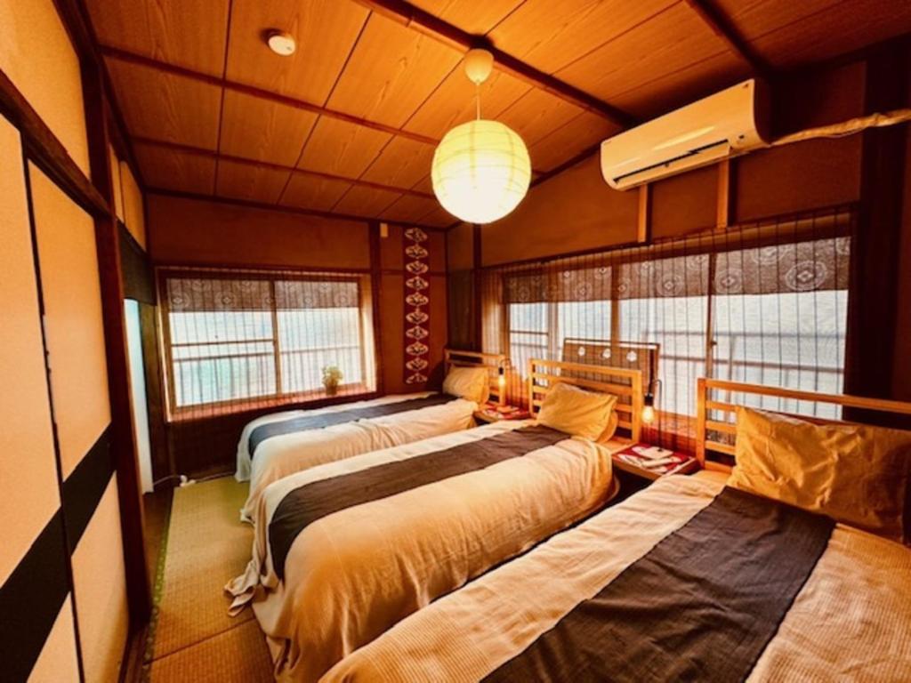 Postel nebo postele na pokoji v ubytování ViVo銀座