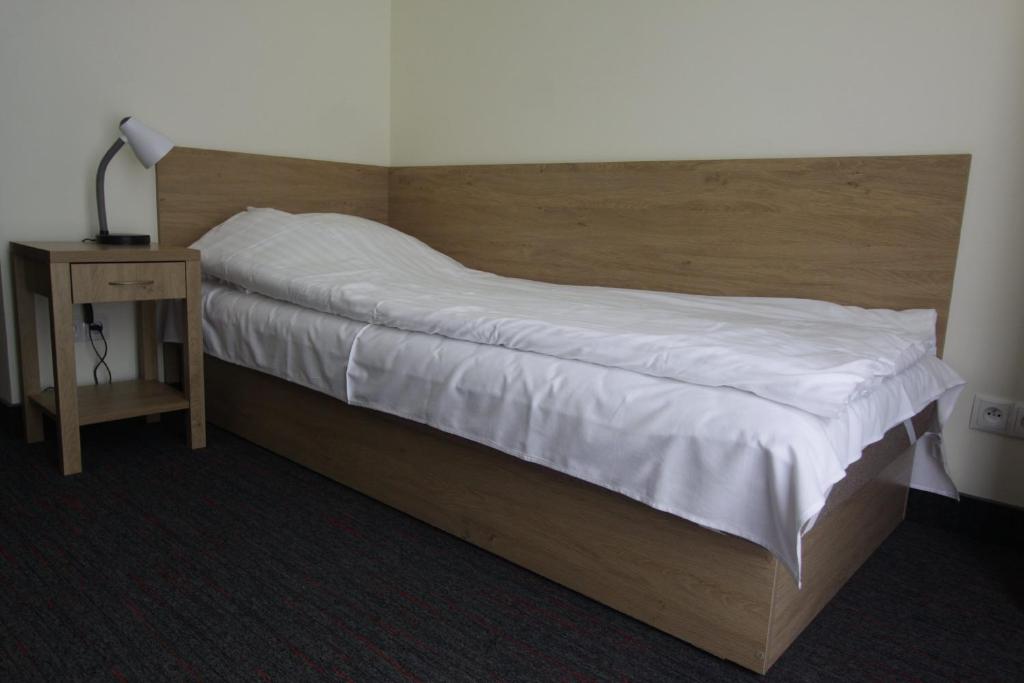Postel nebo postele na pokoji v ubytování Dom Pomocy Studentom