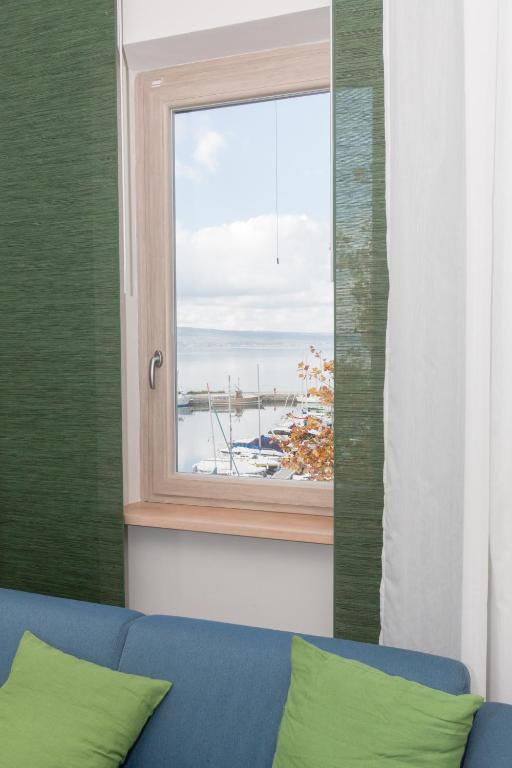 Łóżko lub łóżka w pokoju w obiekcie La Suite Sul Lago