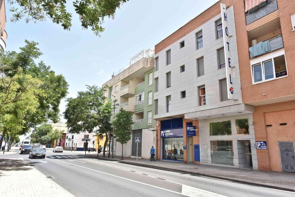 an empty street in a city with buildings at Hotel Adsubia in Denia