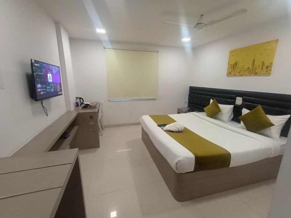 Postel nebo postele na pokoji v ubytování La Riviera Suites