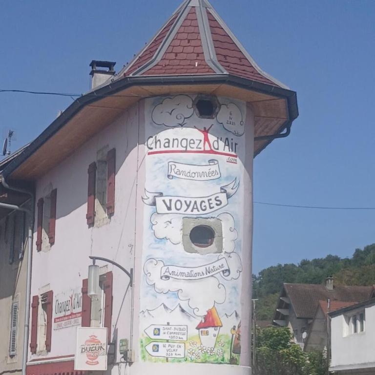 a building with a sign on the side of it at Tour Rose in Frangy