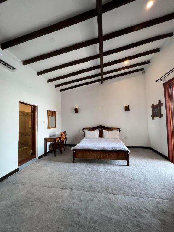 En eller flere senge i et værelse på Waghill B Cottage