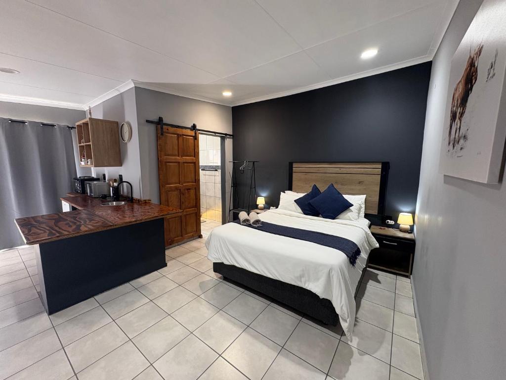 Ένα ή περισσότερα κρεβάτια σε δωμάτιο στο Be Still Haven