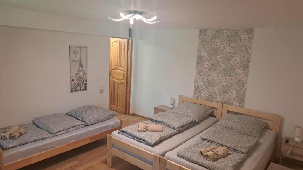 Un ou plusieurs lits dans un hébergement de l'établissement Mieszkanie na wyłączność