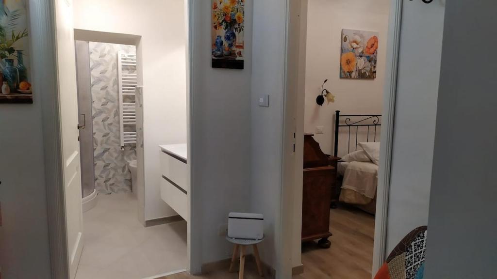 a room with a hallway with a sink and a mirror at Tourist rental 35574 Orvieto in Orvieto