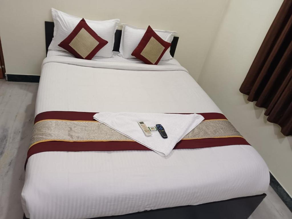 Ένα ή περισσότερα κρεβάτια σε δωμάτιο στο IRIS COMFORT INN BLOSSOM