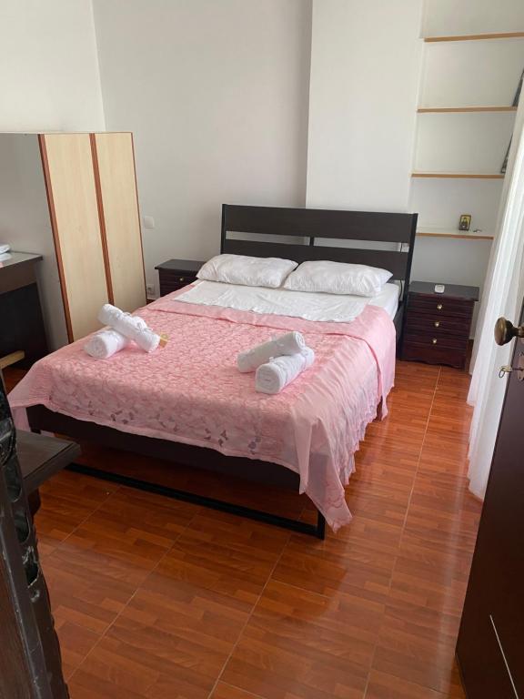 a bedroom with a bed with two towels on it at Northern Comfort Apartment in Athens