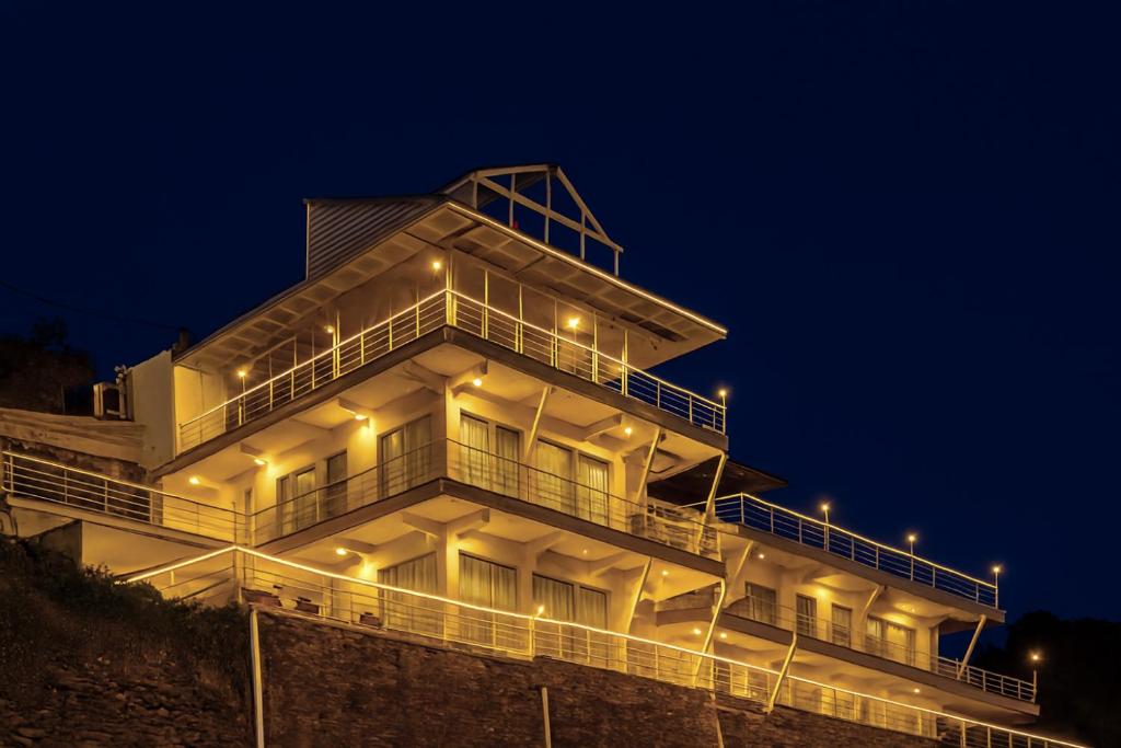 a building with lights on top of it at night at Onehouse Resort Lansdowne in Lansdowne