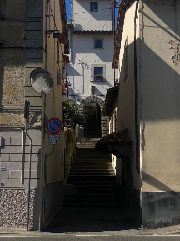 an alley with stairs leading up to a building at Sweet Home Sweet Wine in Lastra a Signa