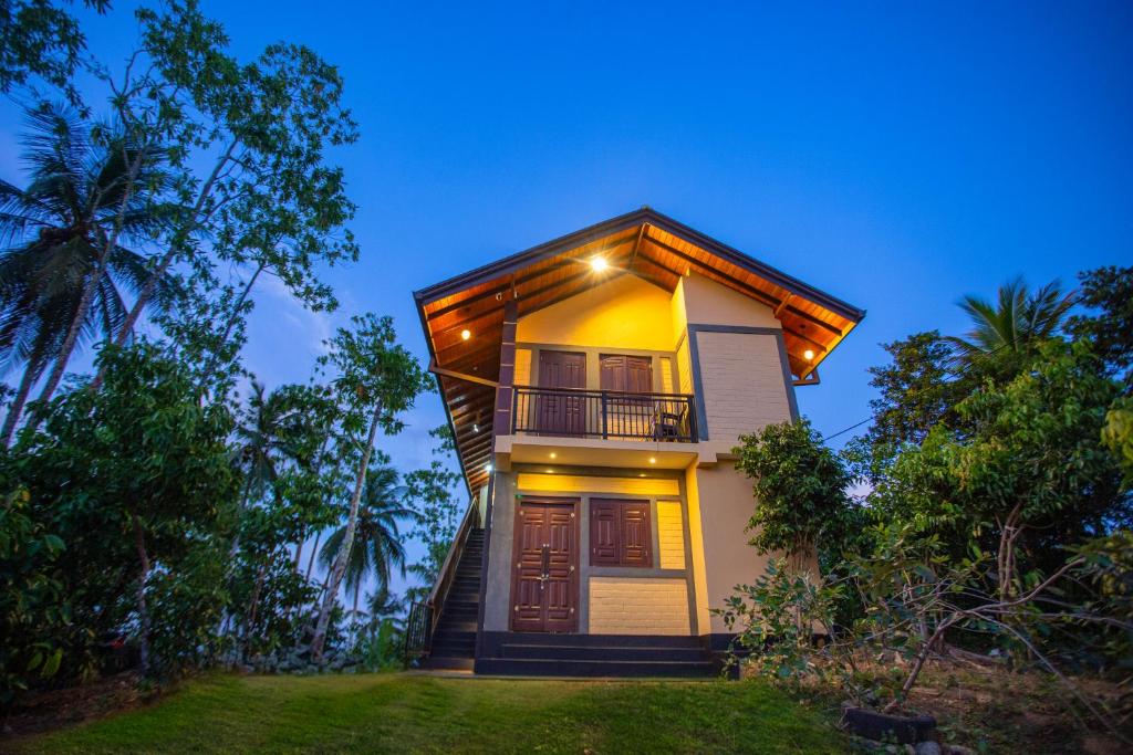 a house with a balcony on the side of it at Cinnamon View Galle in Galle