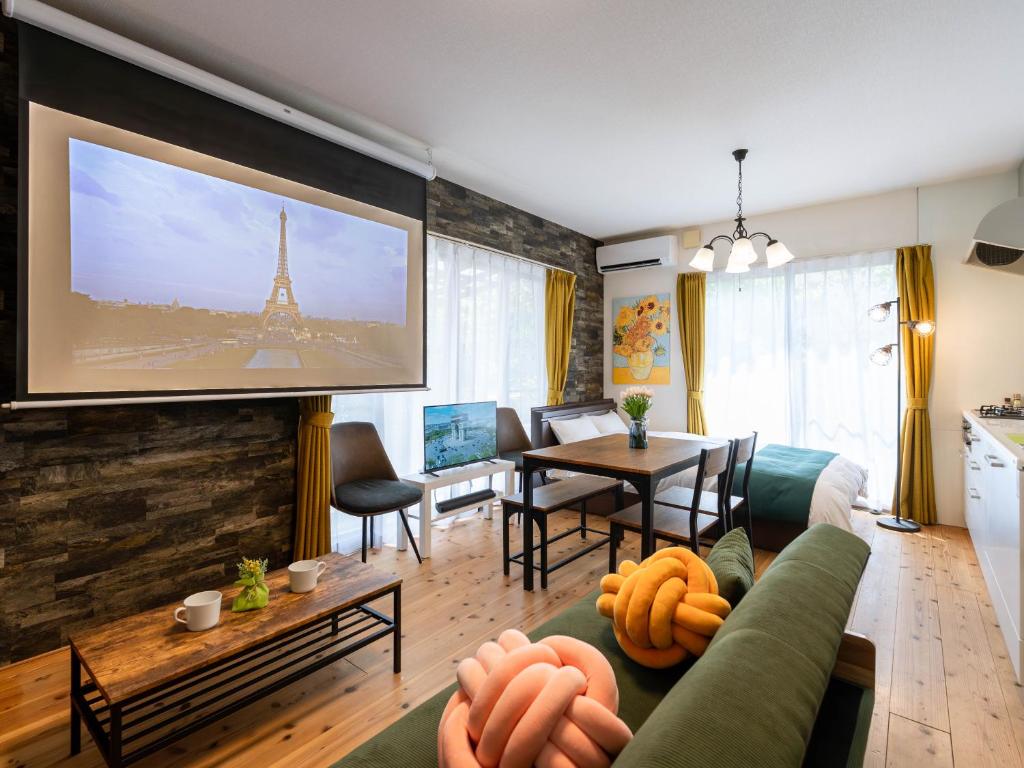 a living room with a couch and a table at 88kawaramachi 一軒家 in Takamatsu